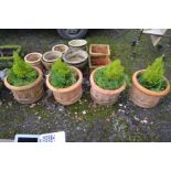 A SET OF FOUR CIRCULAR TERRACOTTA PLANT POTS, with landscape scenes to the sides, diameter 45cm x