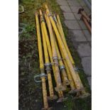 A SET OF TEN YELLOW PAINTED ACROW PROPS, (10)