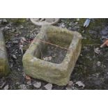 A RECTANGULAR SANDSTONE TROUGH, width 49cm x depth 43cm x height 26cm