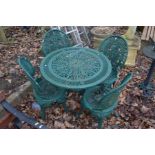 A GREEN PAINTED ALUMINIUM CIRCULAR GARDEN TABLE, diameter 80cm x height 66cm and four matching