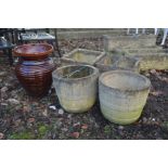 A PAIR OF SQUARE COMPOSITE GARDEN PLANTERS, together with a pair of circular garden planters and a