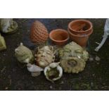 TWO SIMILAR COMPOSITE GROTESQUE WALL MOUNTED PLANTERS, together with three terracotta plant pots,