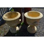 A PAIR OF CLAY CAMPAGNE GARDEN URNS, with twin scrolled handles on a separate base, diameter 56cm