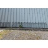 A CAST IRON SPINDLED FENCE, length 434cm x height 86cm, together with a matching smaller fence,