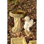 A COMPOSITE TREE STUMP BIRD BATH, height 56cm, together with garden figure of a putto holding an urn