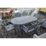 A WROUGHT IRON LATTICE GARDEN TABLE, with rounded corners and undershelf, width 183cm x depth 110cm,