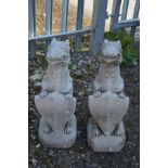 A PAIR OF MODERN COMPOSITE DRIVEWAY FIGURES, of mythical creatures holding a shield, height 73cm