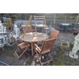 A CIRCULAR TEAK DROP LEAF GARDEN TABLE, diameter 124cm x height 75cm, together with four matching