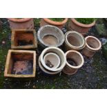 A PAIR OF SQUARE TERRACOTTA PLANTERS, together with three various other terracotta plant pots and