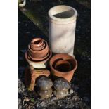A CYLINDRICAL CLAY CHIMNEY POT, height 68cm, together with a collection of terracotta plant pots,