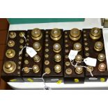 FIVE WOODEN MOUNTED SETS OF BRASS WEIGHTS, as used in French Pharmacies, 500g to 1gram