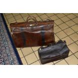 A LARGE LEATHER GLADSTONE BAG, with two straps and lock (missing key), length approximately 63cm,