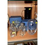 FIVE ITEMS OF GLASSWARE, comprising two silver topped glass scent bottles (one cracked), two boxed