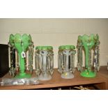 A PAIR OF VICTORIAN GREEN SATIN GLASS LUSTRES, having gilt foliage detailing and facet cut droppers,