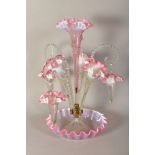 A VICTORIAN VASELINE GLASS EPERGNE, with central frilled pink trumpet vase, framed by three