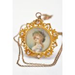 AN EARLY 20TH CENTURY GOLD, DIAMOND AND SEED PEARL PORTRAIT MINIATURE PENDANT/BROOCH, of circular