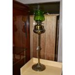 A LATE 19TH/EARLY 20TH CENTURY BRASS OIL LAMP, having brass reservoir, glass funnel and green