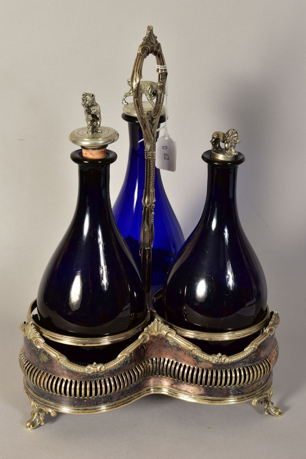 A VICTORIAN PLATED TREFOIL DECANTER STAND, containing three blue glass decanters with novelty - Image 2 of 3