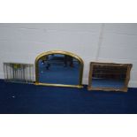 A GILT WOOD FRAMED ARCHED OVERMANTEL MIRROR, together with another wall mirror, two gilt metal
