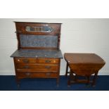AN EDWARDIAN MAHOGANY WASHSTAND with a marble and mirrored splash back and four drawers, width 107cm