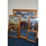 A LARGE MODERN PINE WALL MIRROR, approximately 137cm x 169cm and four various other pine wall