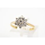 AN 18CT DIAMOND CLUSTER RING, designed as a tiered cluster of brilliant cut diamonds, estimated