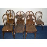 A SET OF SIX OAK WHEEL BACK CHAIRS and another chair (7)