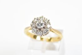 A MODERN ROUND BRILLIANT DIAMOND CLUSTER RING, estimated total diamond weight 0.99ct, ring size R