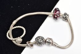 A PANDORA BRACELET AND PANDORA RING, the charm bracelet suspending four charms, together with a