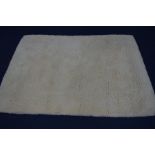 A MODERN MARKS AND SPENCER 100% NEW ZEALAND WOOL CREAM GROUND RUG, 240cm x 170cm (some light