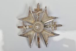 A GERMAN 3RD REICH SPANISH CROSS, in silver colour with crossed swords, marked to reverse 'CEJ'