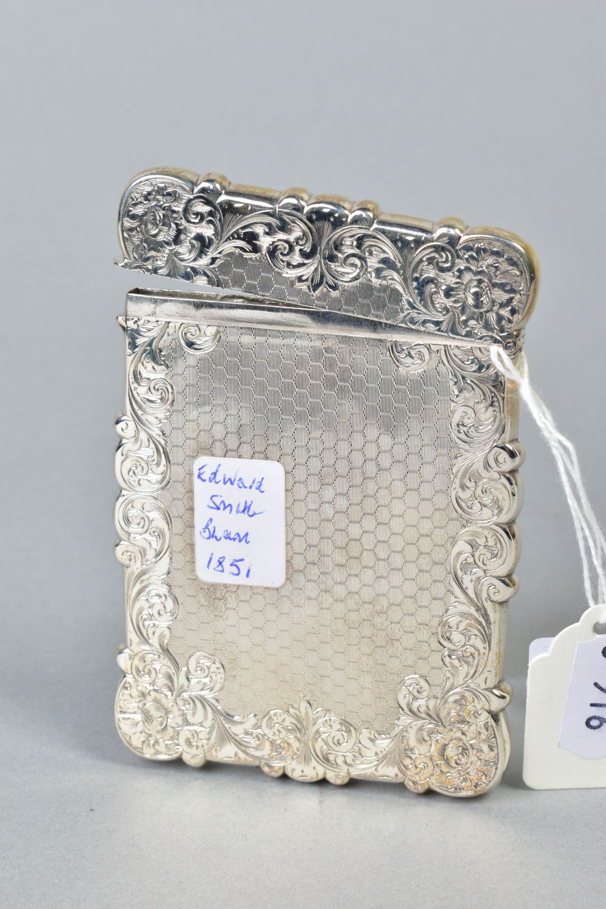 A MID VICTORIAN SILVER CARD CASE OF WAVY RECTANGULAR OUTLINE, foliate engraved and engine turned - Image 2 of 2