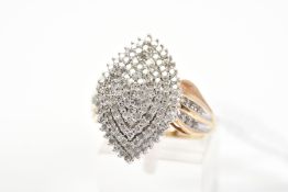 A 9CT GOLD DIAMOND DRESS RING, the marquise shape panel claw set with single cut diamonds in a