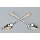 A PAIR OF GEORGE IV SILVER OLD ENGLISH PATTERN BASTING SPOONS, engraved monograms, maker Jonathon