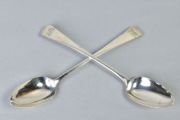 A PAIR OF GEORGE IV SILVER OLD ENGLISH PATTERN BASTING SPOONS, engraved monograms, maker Jonathon