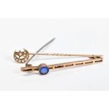 AN EARLY 20TH CENTURY BROOCH AND STICKPIN, the bar brooch with off set circular blue paste in a