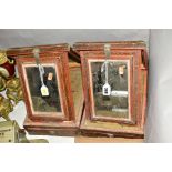 TWO 19TH CENTURY INDIAN TRAVELLING MIRRORS, the rectangular cases with painted and varnished