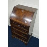 A SLIM REPRODUCTION MAHOGANY BUREAU, with four drawers