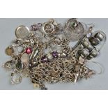 A SELECTION OF SILVER AND WHITE METAL JEWELLERY, to include an 1889 Victoria coin, a charm bracelet,