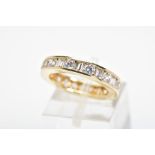 A 14CT GOLD CUBIC ZIRCONIA ETERNITY RING, designed as channel set circular and rectangular