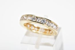 A 14CT GOLD CUBIC ZIRCONIA ETERNITY RING, designed as channel set circular and rectangular