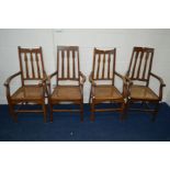 TWO PAIRS OF ARTS & CRAFTS OAK ARMCHAIRS, with cane seats