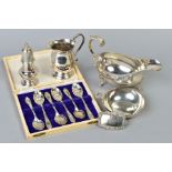 A GROUP OF 20TH CENTURY SILVER, comprising an oval sauceboat, gadrooned rim, S scroll handle, on