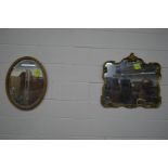 A FOLIATE GILT WOOD FRAMED WALL MIRROR, together with an oval wall mirror (2)
