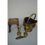 A BRASS LOG BUCKET, together with a pair of brass candlesticks, an oak milking stool, glass lamp