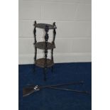 A CAST IRON THREE TIER STAND and two fire irons (3)