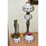 A PAIR OF WMF SILVER PLATED CANDLESTICKS, converted to oil lamps by the addition of cranberry