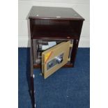 A PHOENIX COMBINATION SAFE, (with combination but no security key) in a separate mahogany cabinet