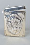 A LATE VICTORIAN SILVER CARD CASE OF RECTANGULAR FORM, hinged top, repousse decorated with central