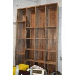 A VINTAGE PINE PIGEON HOLE CABINET, length 277cm x width 122cm x depth 28cm with twenty seven